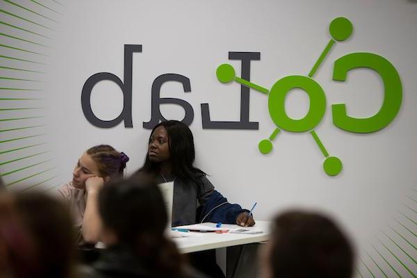 Student in front of CoLab sign