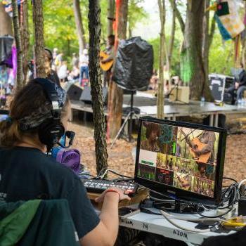 学生 work on recording equipment backstage during the 2022 Nelsonville Music Festival